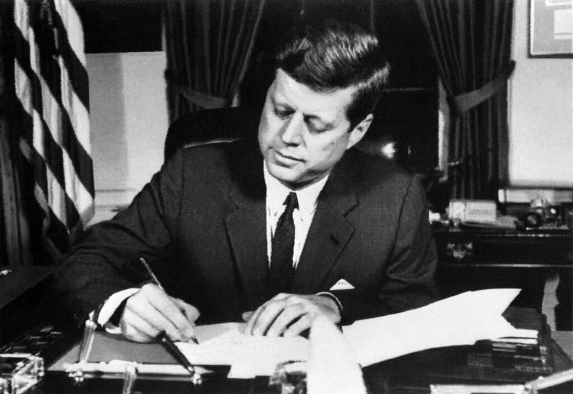 US President John F. Kennedy signs the order of a naval quarantine of Cuba on October 23, 1962 at the White House US President John F. Kennedy signs the order of a naval quarantine of Cuba on October 23, 1962 at the White House