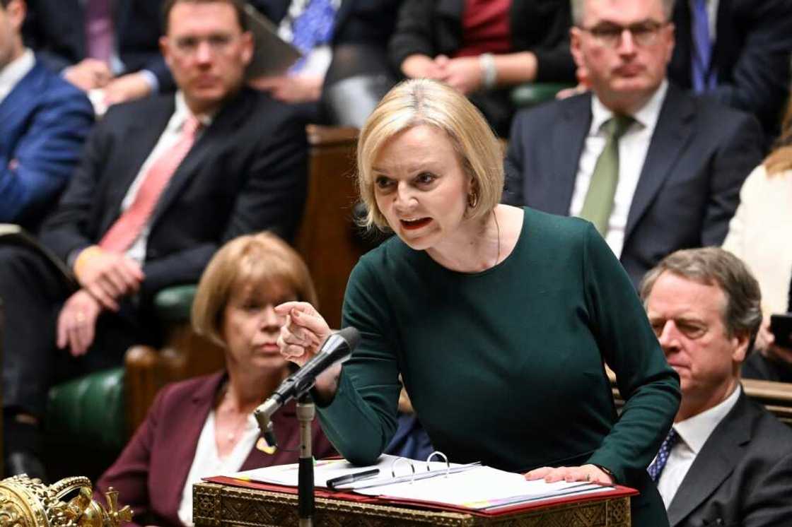 A handout photograph released by the UK Parliament shows Britain's Prime Minister Liz Truss gesturing and speaking during the Prime Minister's Questions (PMQ's) at the House of Commons, in London, on October 12, 2022. A handout photograph released by the UK Parliament shows Britain's Prime Minister Liz Truss gesturing and speaking during the Prime Minister's Questions (PMQ's) at the House of Commons, in London, on October 12, 2022.