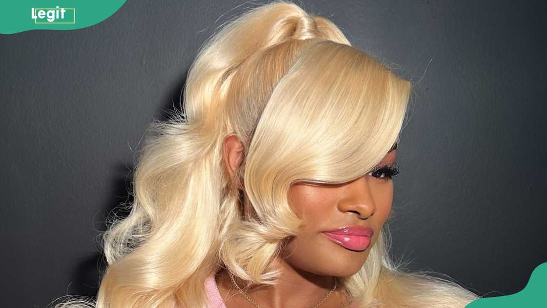 High ponytail with cascading soft waves High ponytail with cascading soft waves