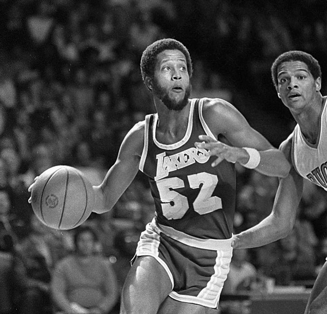 Jamaal Wilkes dribbles the ball during a game Jamaal Wilkes dribbles the ball during a game