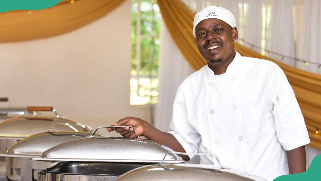 A man showing bain-marie in a hotel restaurant