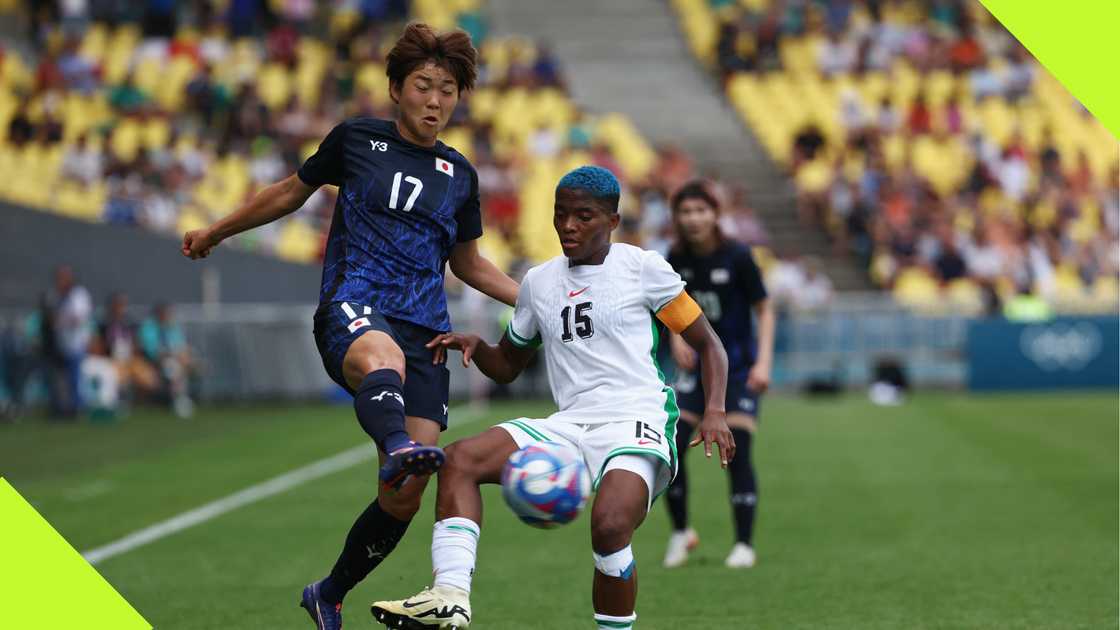Rasheedat Ajibade duels for the ball with Maika Hamano. Rasheedat Ajibade duels for the ball with Maika Hamano.