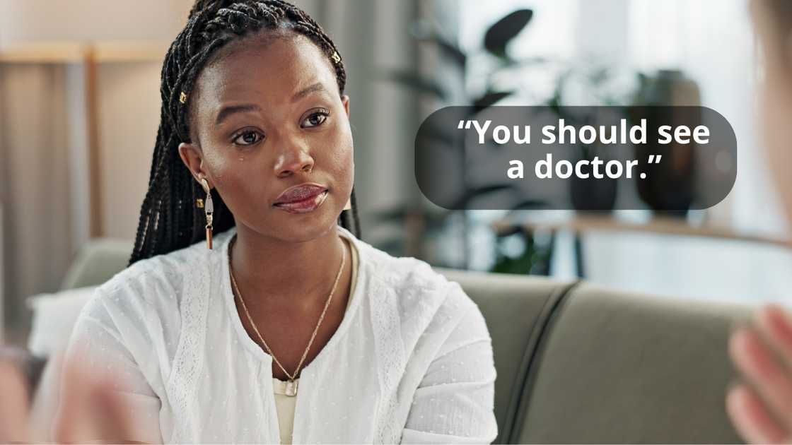A woman therapist talking to a patient in her office