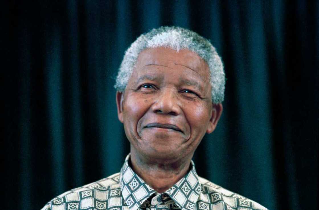 Former President Nelson Mandela of South Africa in a green and white shirt Former President Nelson Mandela of South Africa in a green and white shirt