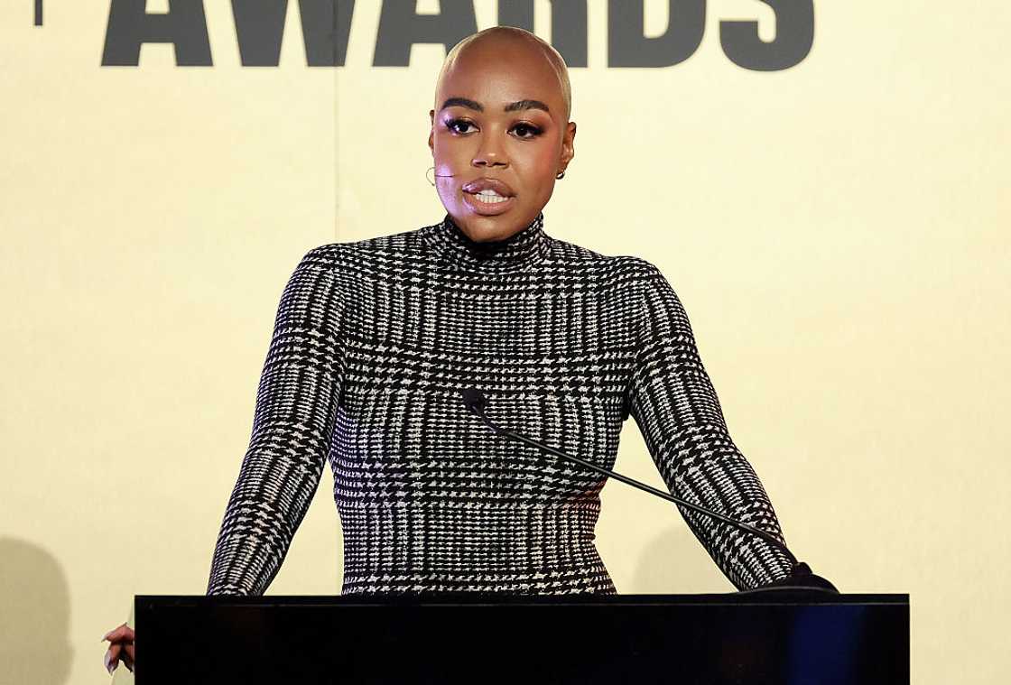 Christine Williamson speaking on a podium at ESPN's Sports Humanitarian Awards