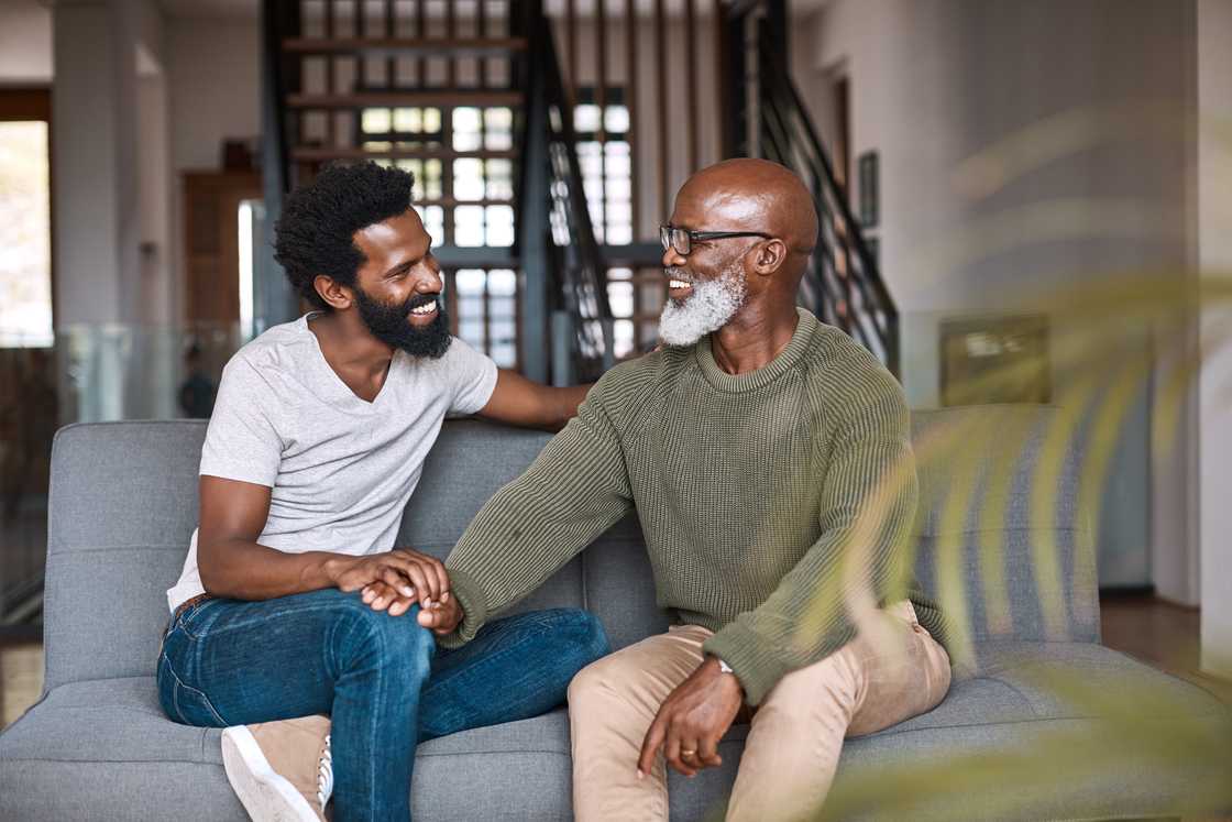 A young man is relaxing and spending time with his father