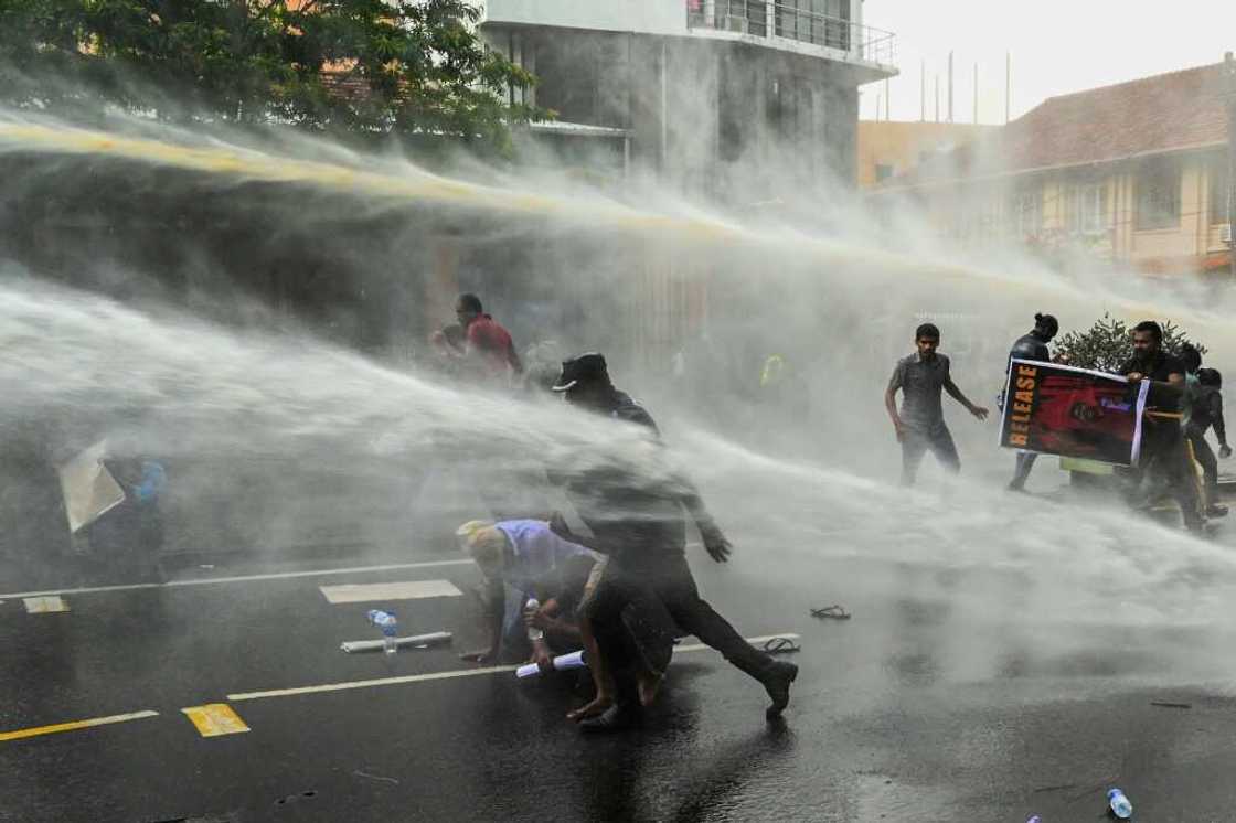 Police use water cannon to disperse demonstrators in Colombo on Tuesday Police use water cannon to disperse demonstrators in Colombo on Tuesday