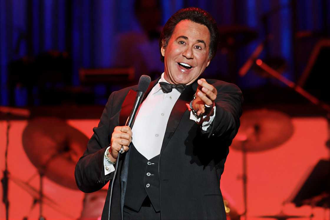 Wayne Newton sings and gestures during a live performance of his show Once Before I Go Wayne Newton sings and gestures during a live performance of his show Once Before I Go
