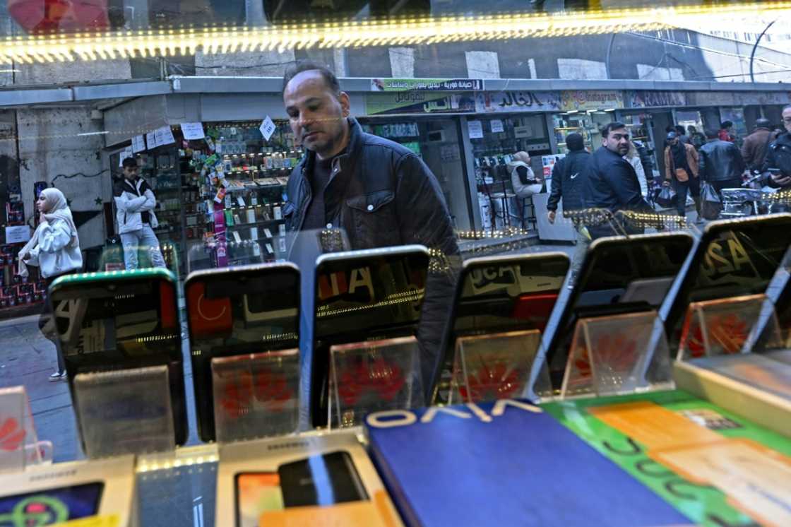 Security forces used to regularly raid a Damascus district where many phone stores operate to enforce an Assad-linked company's monopoly Security forces used to regularly raid a Damascus district where many phone stores operate to enforce an Assad-linked company's monopoly