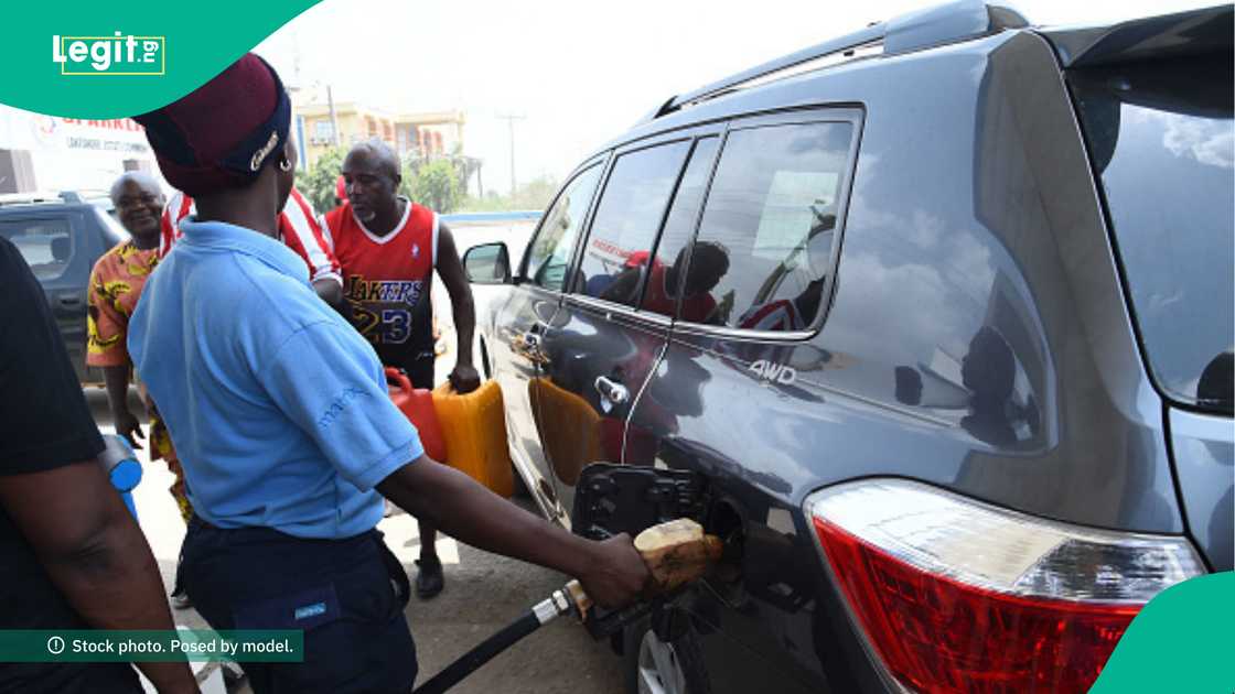 Petrol being dispensed at a filling station.