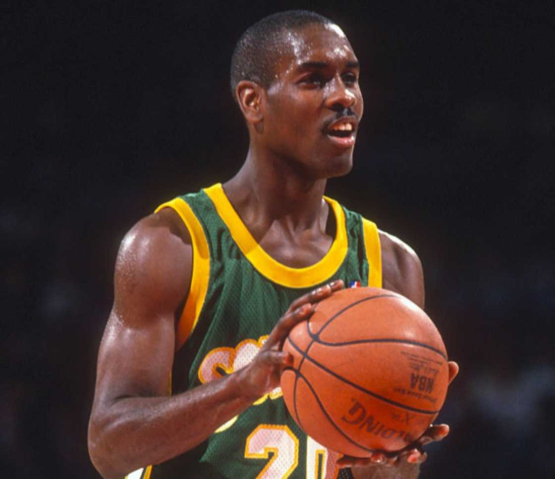 Gary Payton stands at the free-throw line preparing to shoot against the Washington Bullets