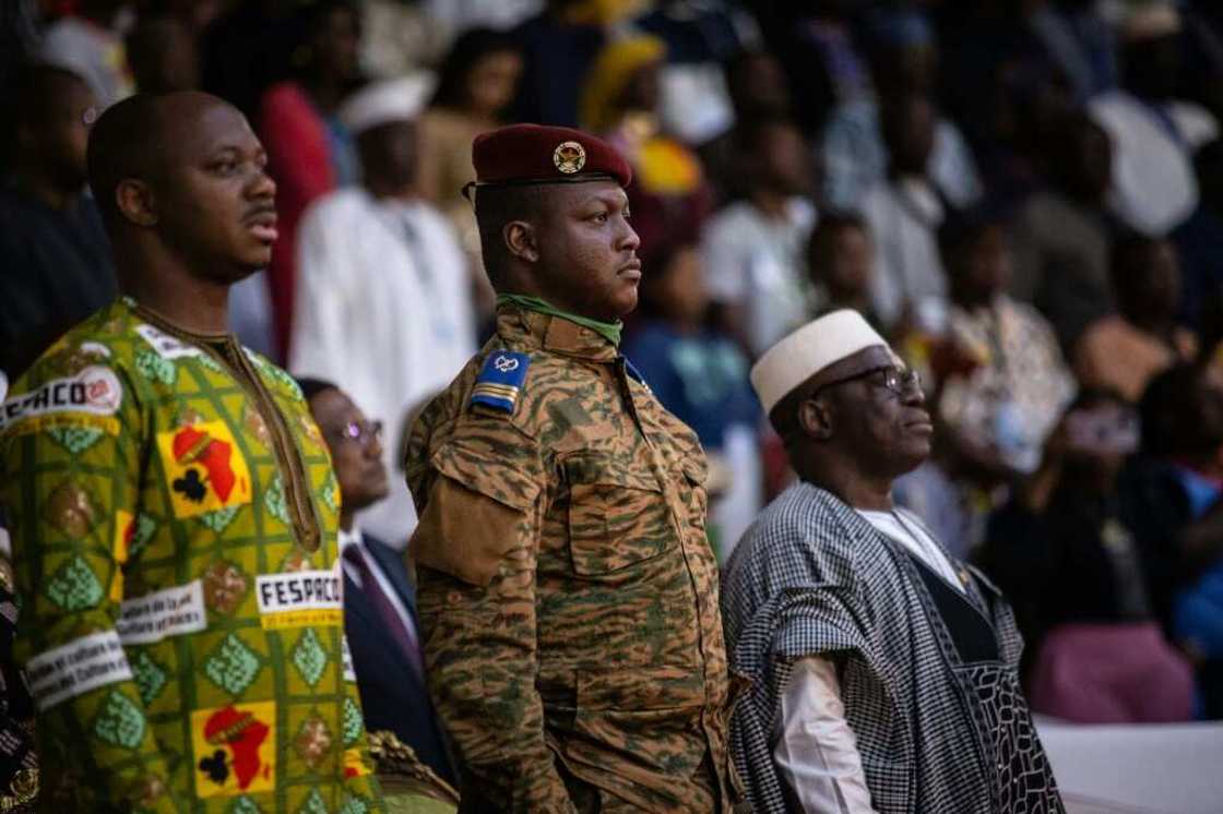 Capitain Ibrahim Traore (centre) has vowed to recover lost territory since taking power in a September coup