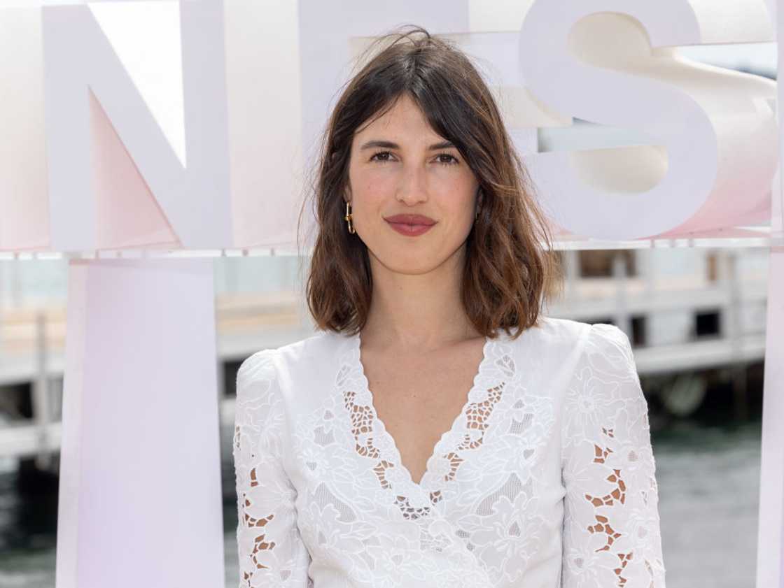 Jeanne Damas in a white lace dress at the 7th Canneseries International Festival