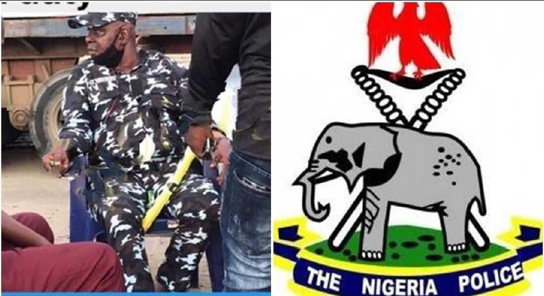 Nigerian police officer caught smoking in public. Nigerian police officer caught smoking in public.