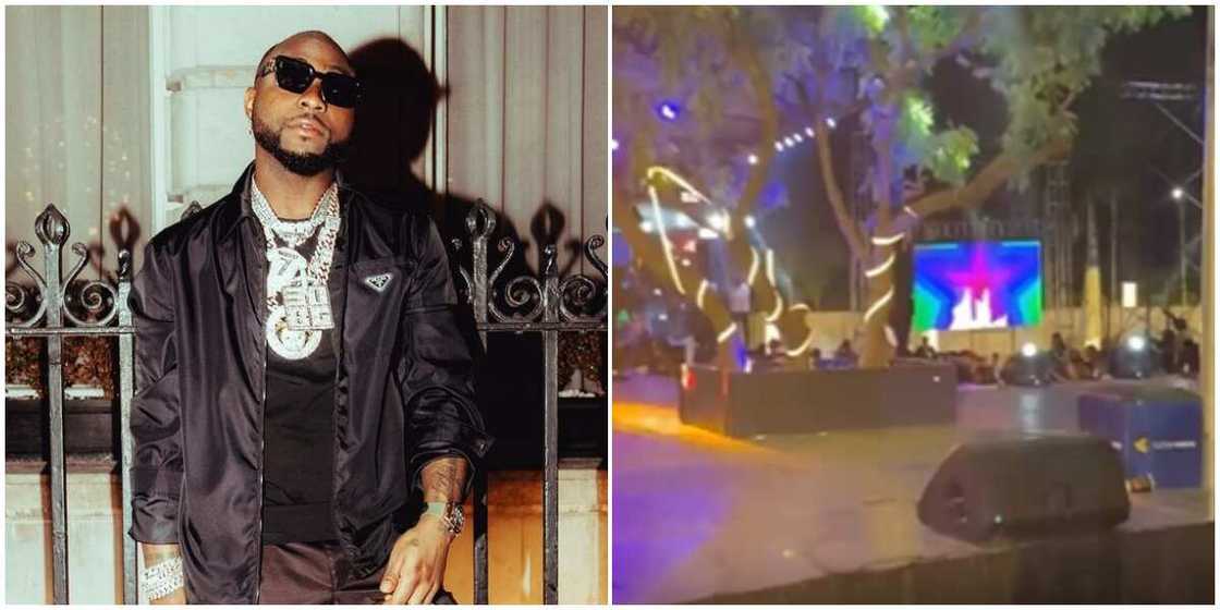 Fan grabs Davido on stage. Fan grabs Davido on stage.