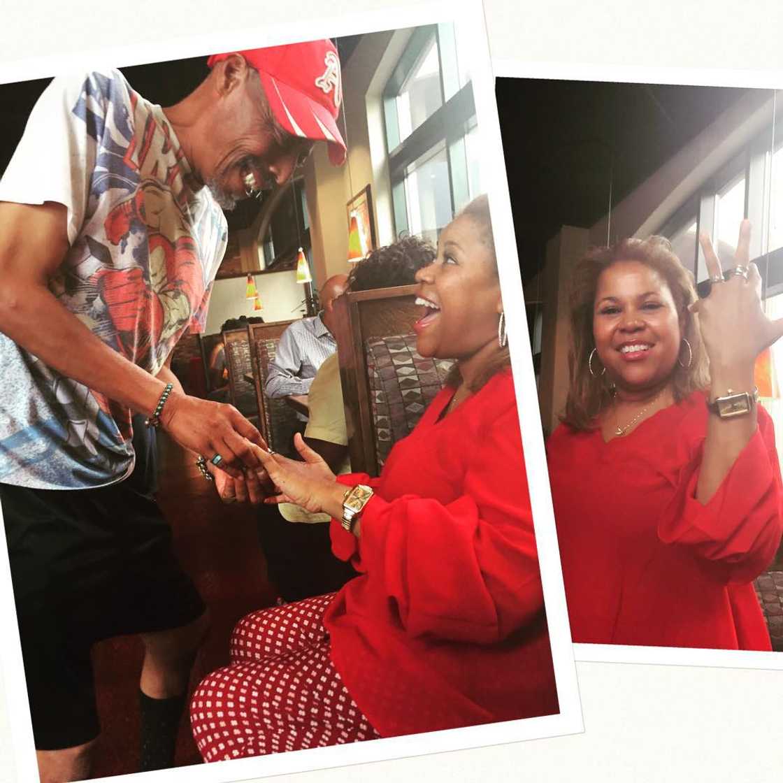 A man putting a ring on Sybil Wilkes finger and her showing it off A man putting a ring on Sybil Wilkes finger and her showing it off