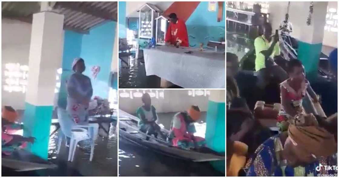 Flooded church, boats, priest, members, worship centre, church service held in flooded place Flooded church, boats, priest, members, worship centre, church service held in flooded place