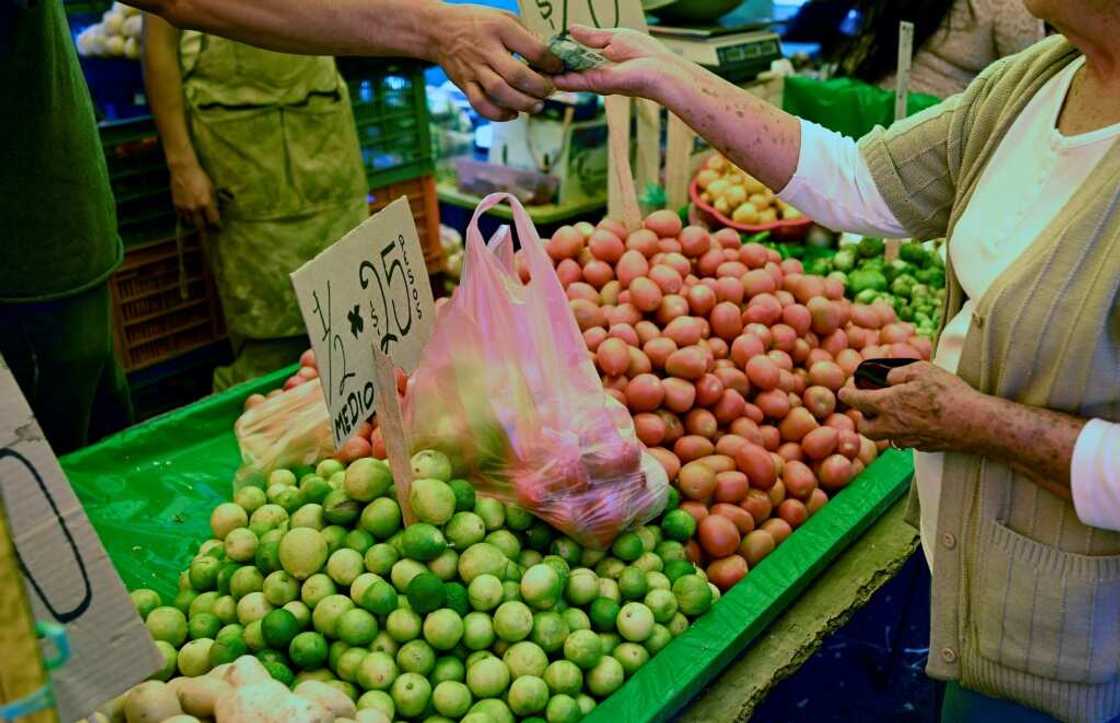 A woman buys limes at a market in Morelia, the capital of Mexico's Michoacan state A woman buys limes at a market in Morelia, the capital of Mexico's Michoacan state