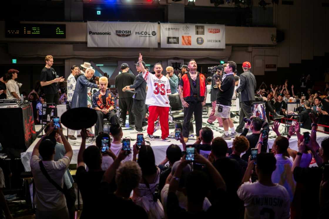 Barbers react after competing in the World Barber Classic in Tokyo, part of a bid to bring back young male clients to shops Barbers react after competing in the World Barber Classic in Tokyo, part of a bid to bring back young male clients to shops