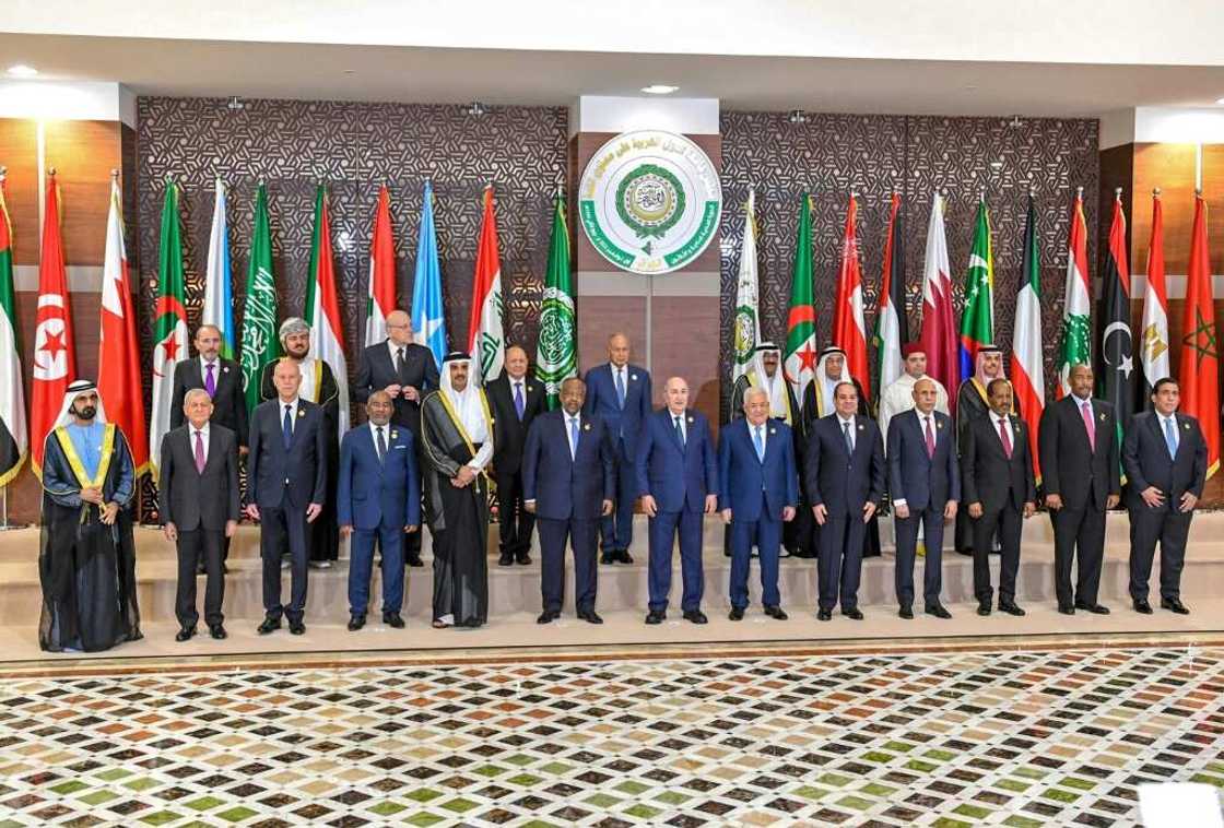 A handout picture provided by the Tunisian presidency press service shows Arab League leaders posing in the Algerian capital following their first summit since a string of normalisation deals with Israel A handout picture provided by the Tunisian presidency press service shows Arab League leaders posing in the Algerian capital following their first summit since a string of normalisation deals with Israel