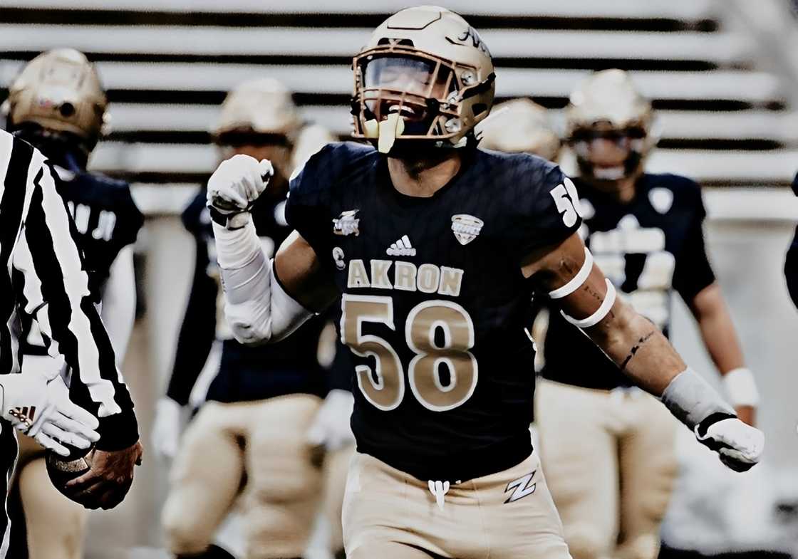 Marco Donatelli reacts while in a black University of Akron football jersey Marco Donatelli reacts while in a black University of Akron football jersey