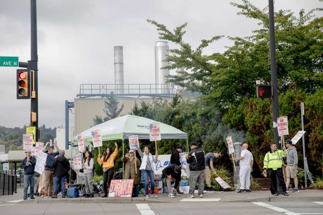 Striking Boeing workers and their supporters picket outside the Boeing Co. manufacturing facility in Renton, Washington on September 16, 2024 Striking Boeing workers and their supporters picket outside the Boeing Co. manufacturing facility in Renton, Washington on September 16, 2024
