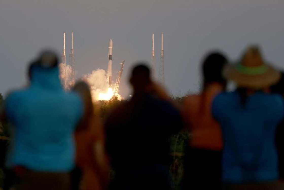 People watch as a SpaceX Falcon 9 rocket lifts off at Cape Canaveral Space Force Station on February 27, 2023 People watch as a SpaceX Falcon 9 rocket lifts off at Cape Canaveral Space Force Station on February 27, 2023
