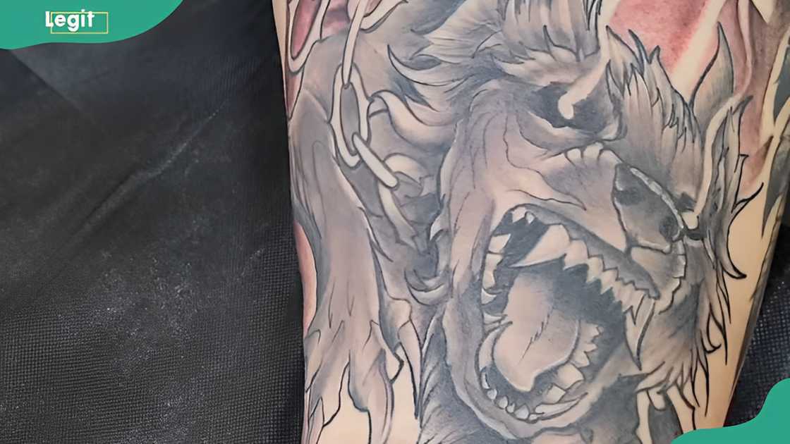 Fenrir thigh tattoo