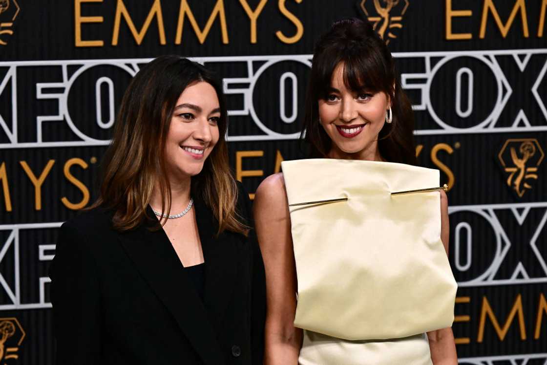 Aubrey Plaza (R) and sister Natalie Plaza (L) posing for a photo at an event