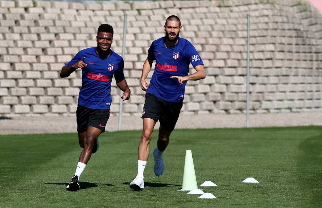 Thomas Lemar and Yannick Carrasco in action Thomas Lemar and Yannick Carrasco in action