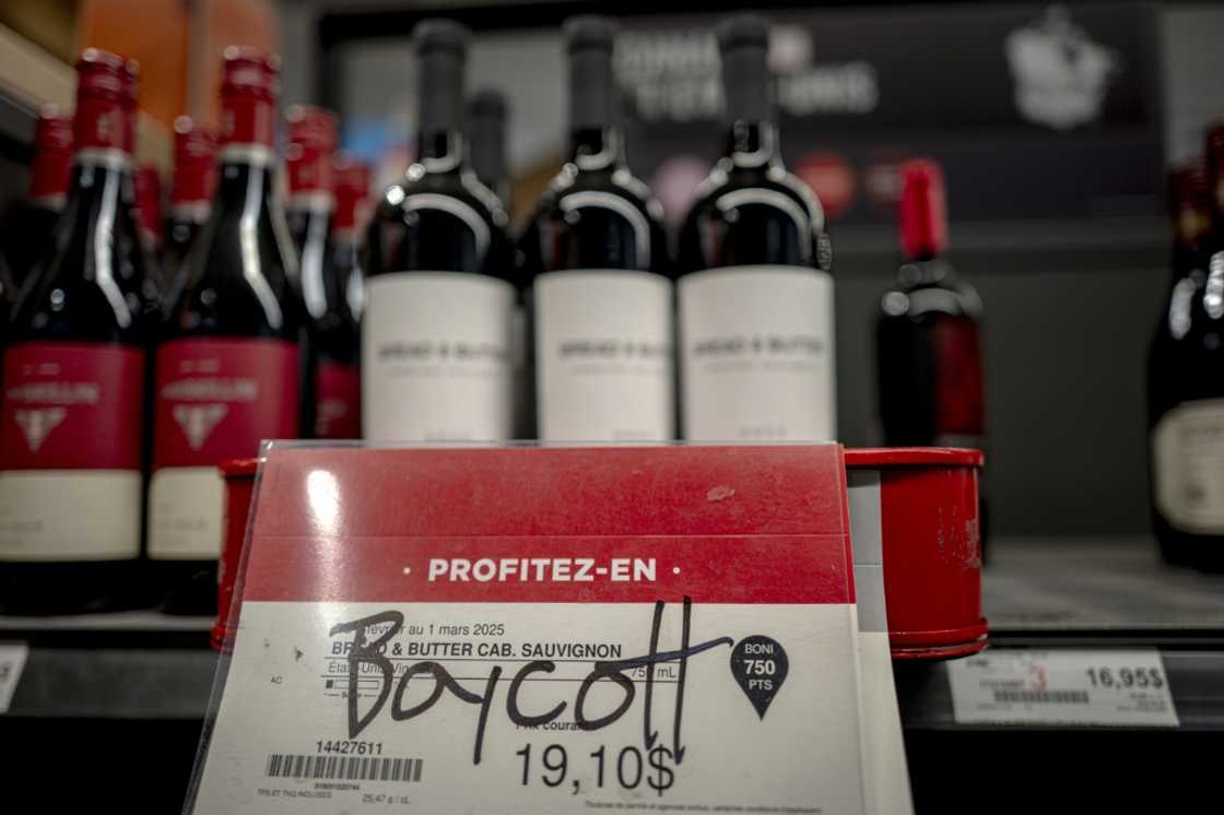 A grafitti scrawl urges a boycott of US wine at a liquor store in Montreal, Canada