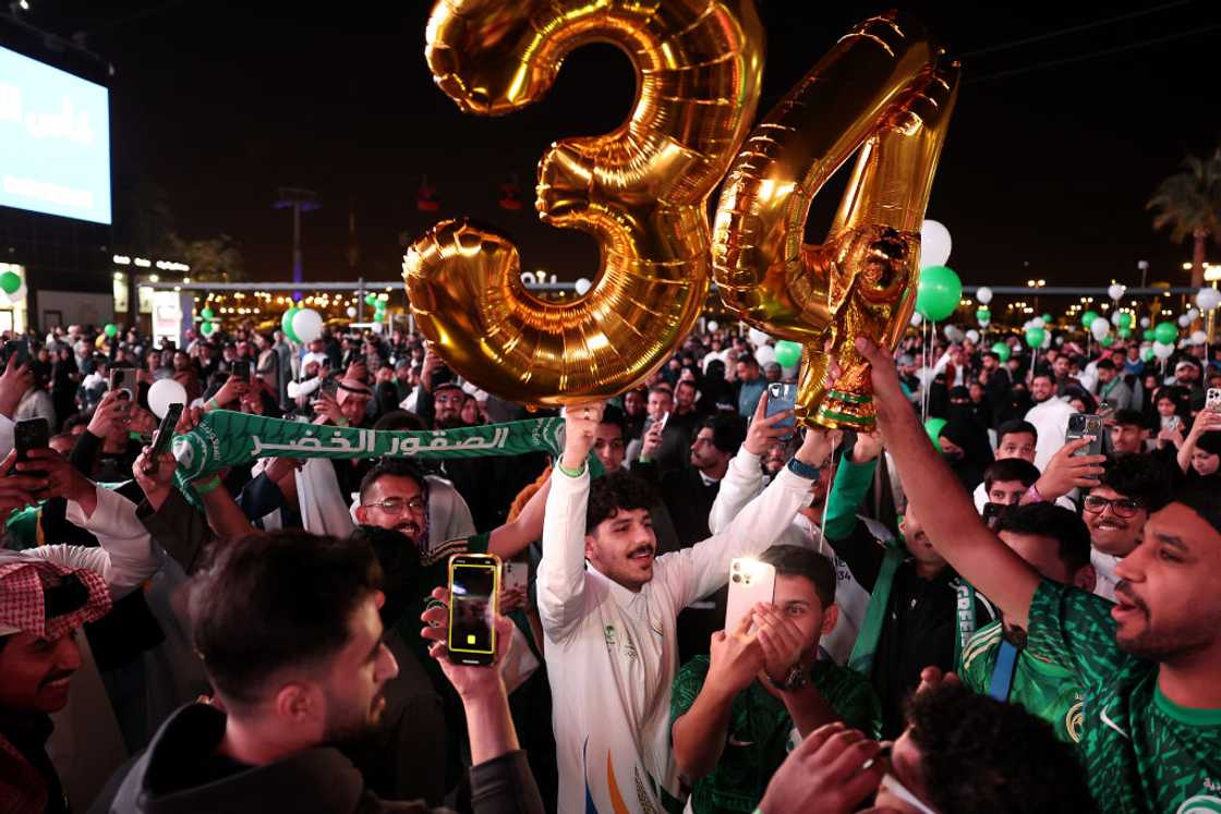 Members of the public celebrate as Saudi Arabia is announced as the host nation for the FIFA World Cup 2034 Members of the public celebrate as Saudi Arabia is announced as the host nation for the FIFA World Cup 2034