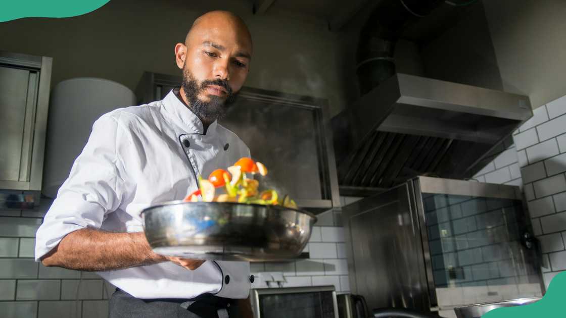 A man cooking in a kitchen
