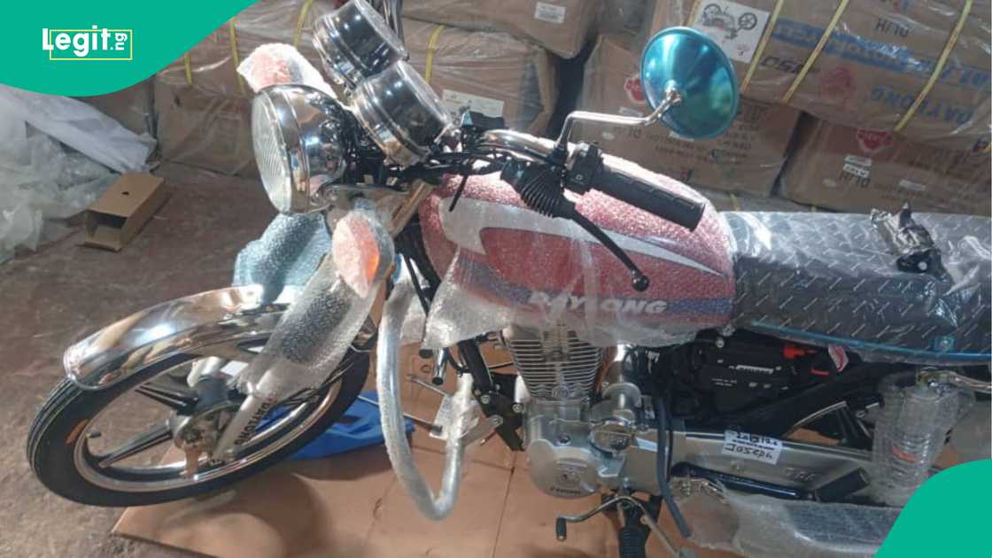 Man displays the receipt of his motorcycle.