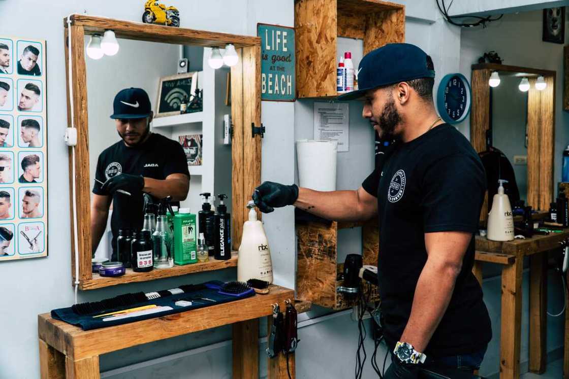 A man working as a beautician in a barbershop