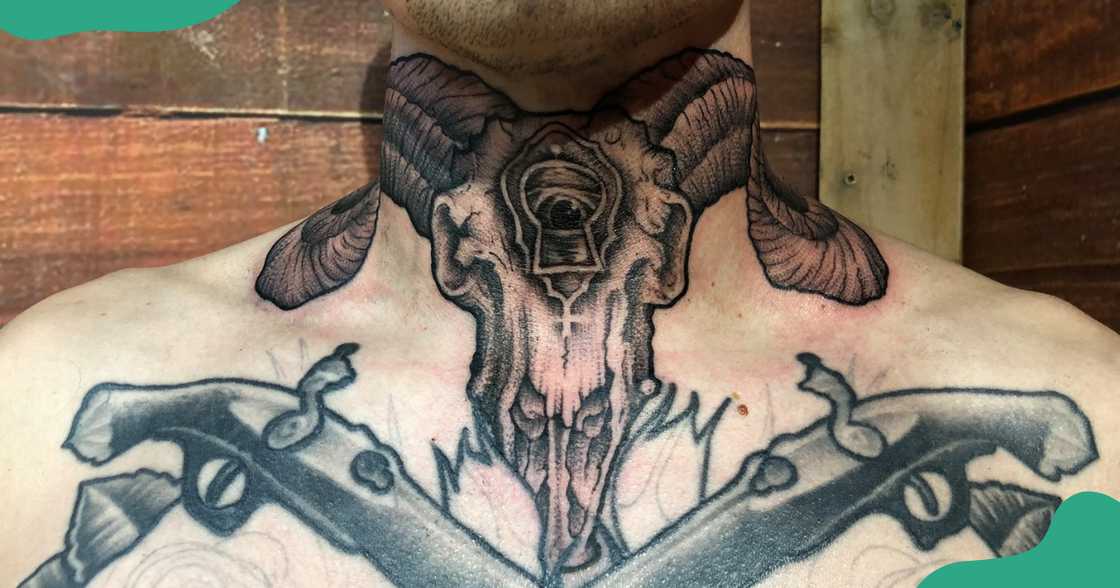 A skull tattoo based on the Capricorn symbol on a man's throat. A skull tattoo based on the Capricorn symbol on a man's throat.