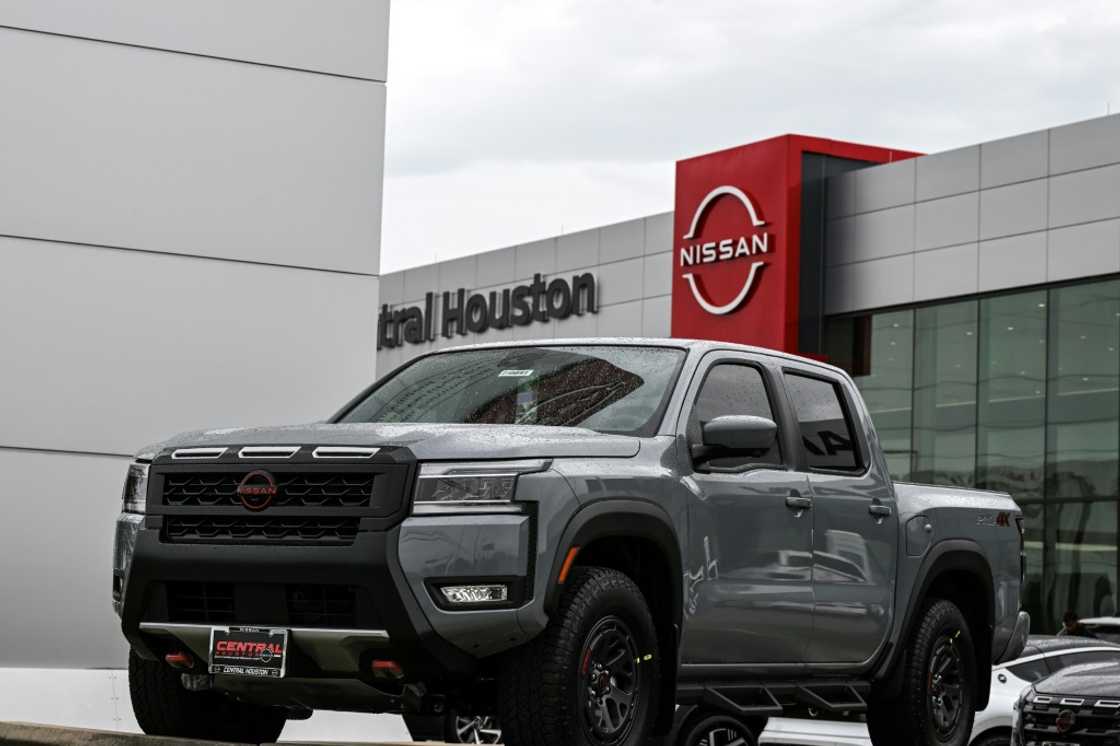 A Nissan Frontier pickup truck -- a type of vehicle highly popular in Texas -- is parked in front of a dealership in Houston A Nissan Frontier pickup truck -- a type of vehicle highly popular in Texas -- is parked in front of a dealership in Houston