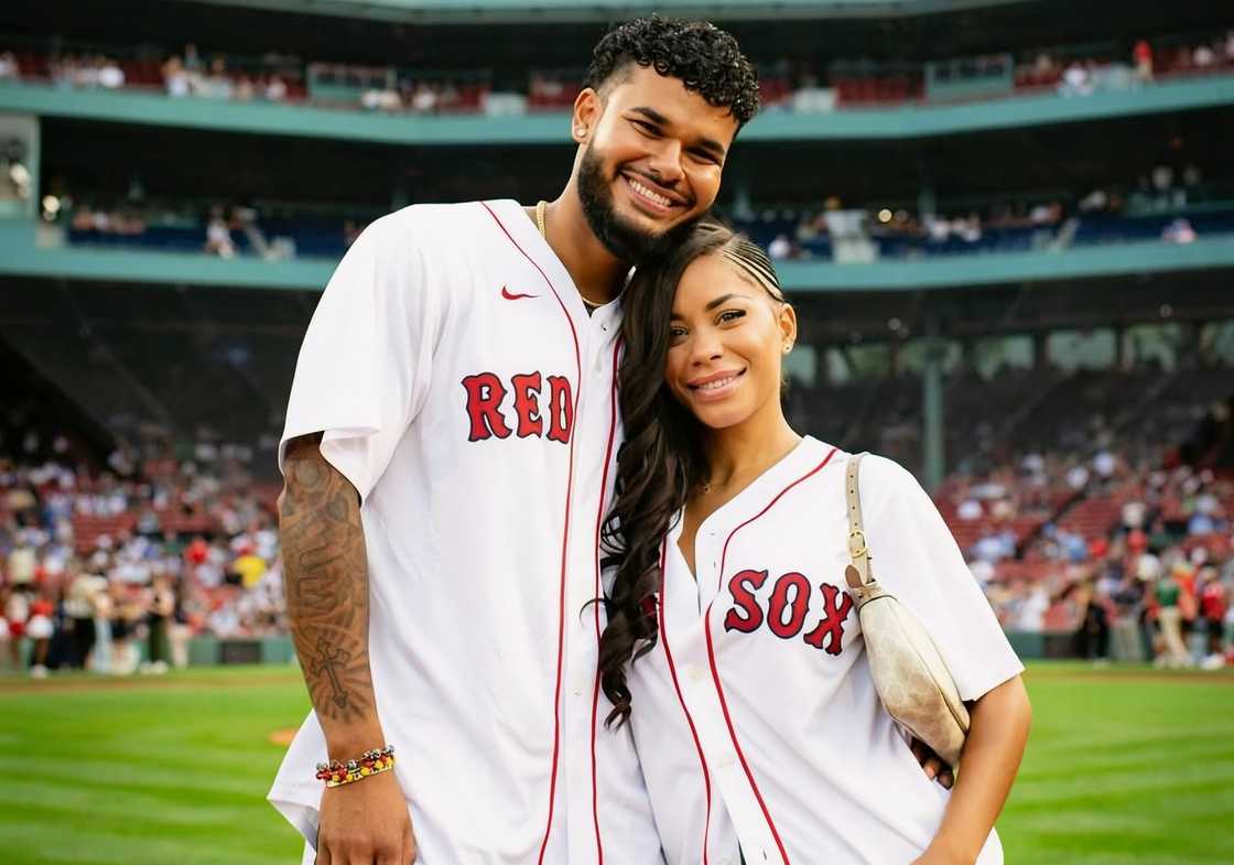Amaya Espinal and Bryan Arenales pose on a baseball field Amaya Espinal and Bryan Arenales pose on a baseball field