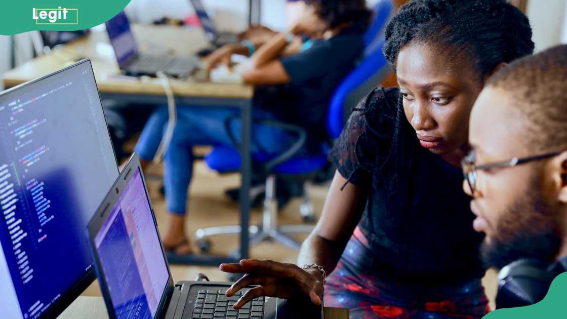 Students coding together in Lagos, Nigeria Students coding together in Lagos, Nigeria