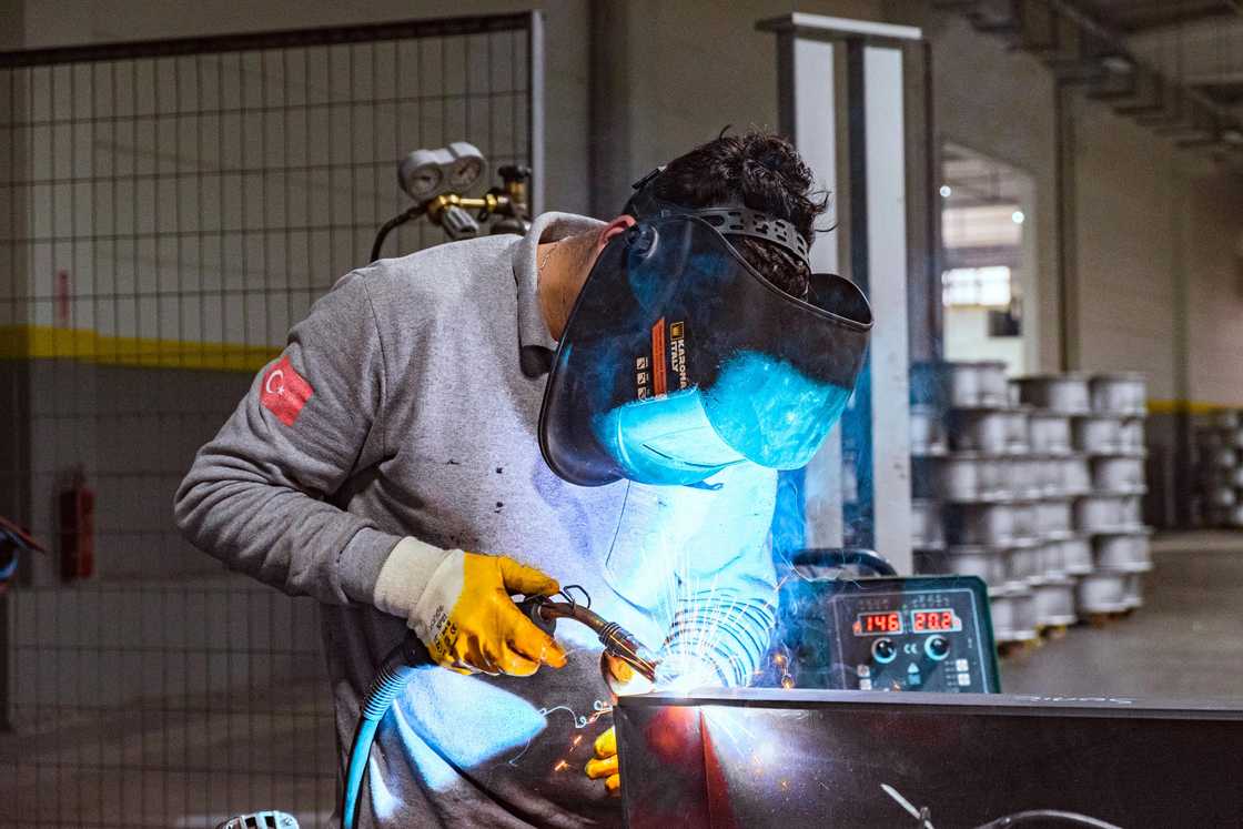 An electrical engineering working with a mask An electrical engineering working with a mask