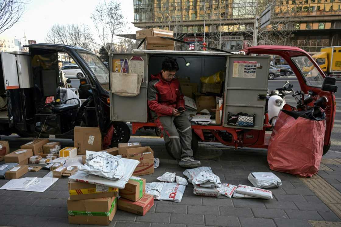 Government data on Friday showed the economy grew by five percent in 2024 -- hitting a much-touted government target but its lowest since 1990 Government data on Friday showed the economy grew by five percent in 2024 -- hitting a much-touted government target but its lowest since 1990