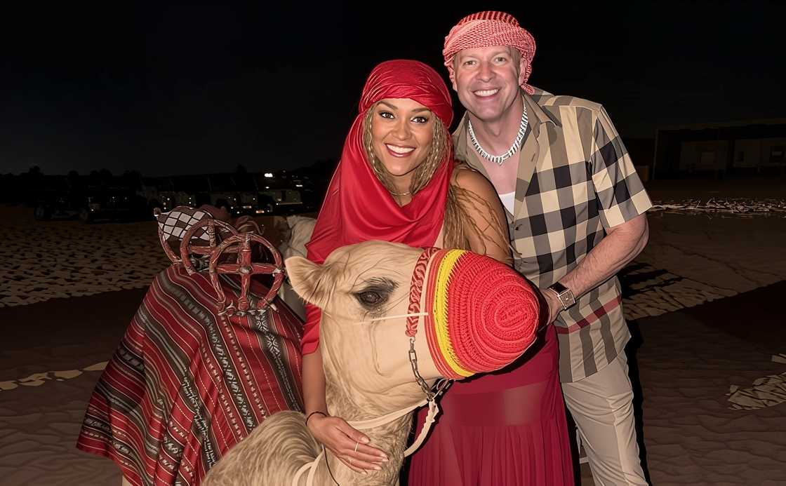 Gary Owen and his wife Brianna Johnson pose with a camel Gary Owen and his wife Brianna Johnson pose with a camel