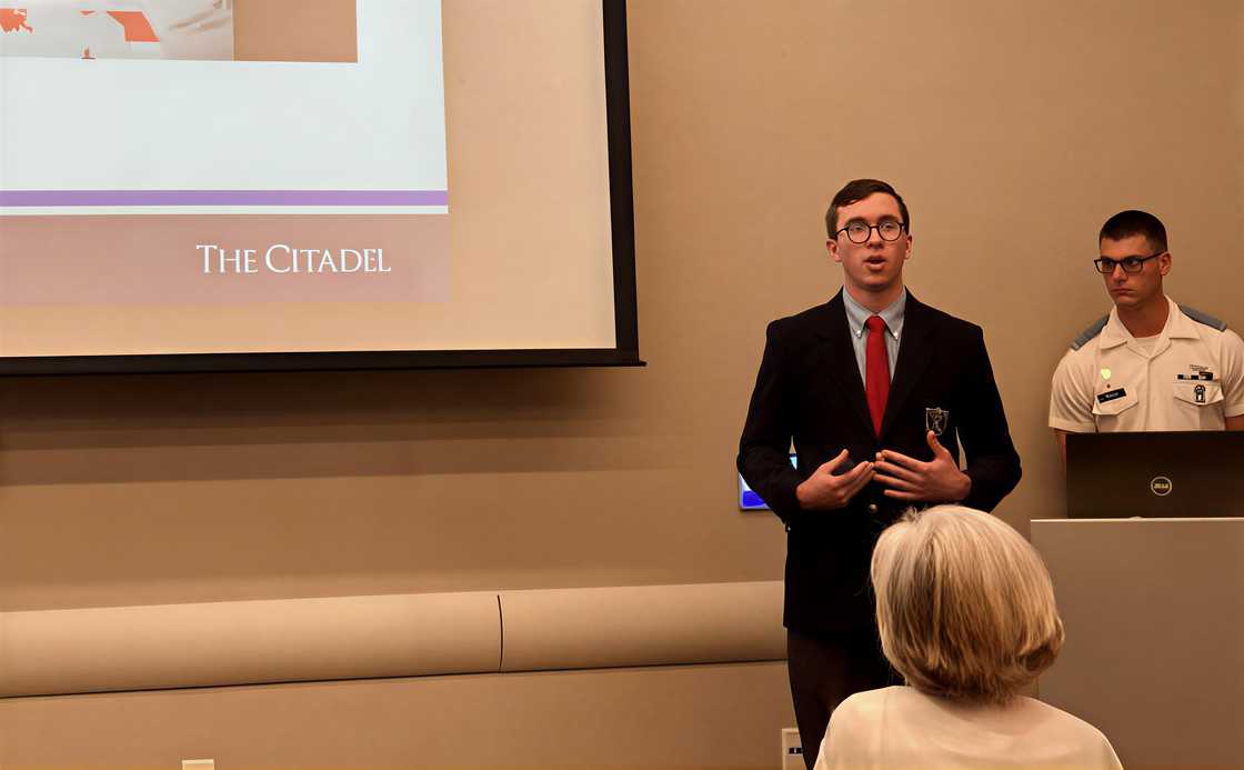 Philip Stracke speaks in front of an audience