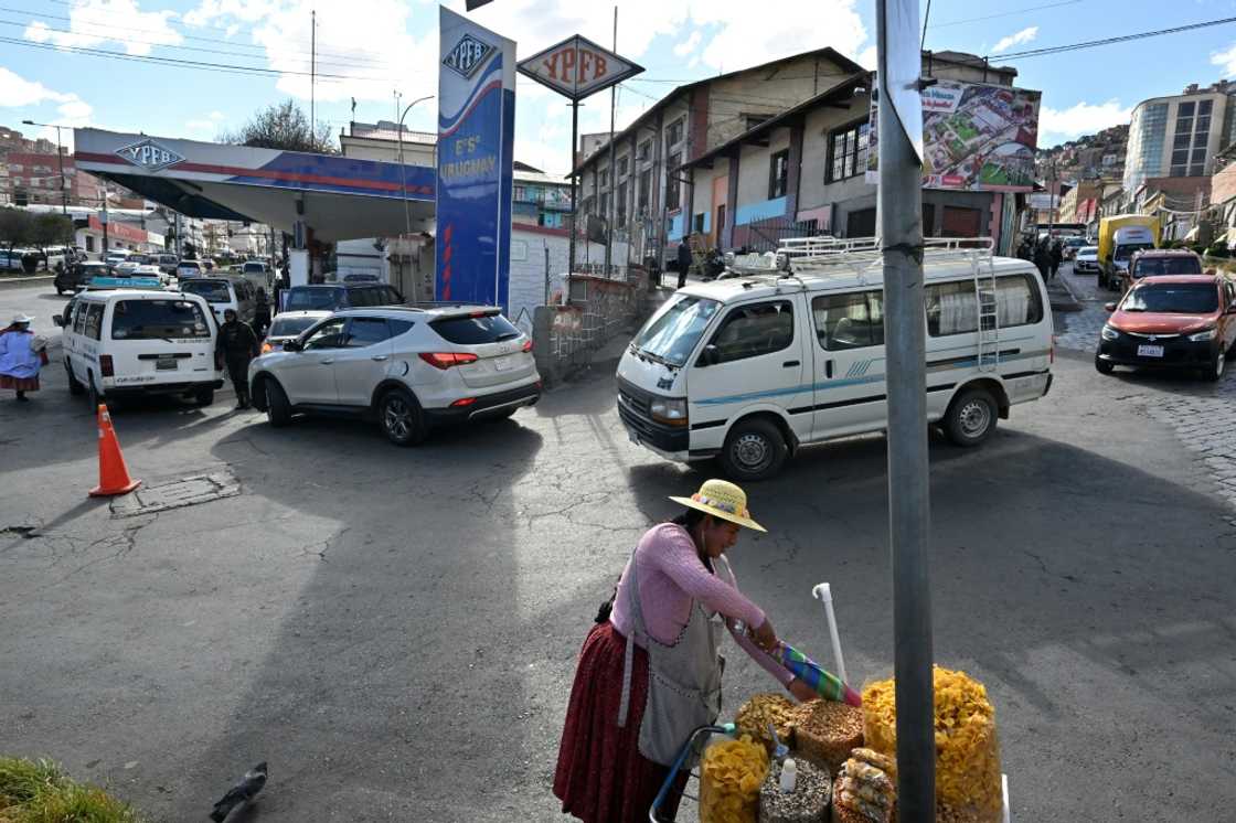 Long lines for fuel at petrol stations have become a defining image of Bolivia's worst economic crisis in a generation