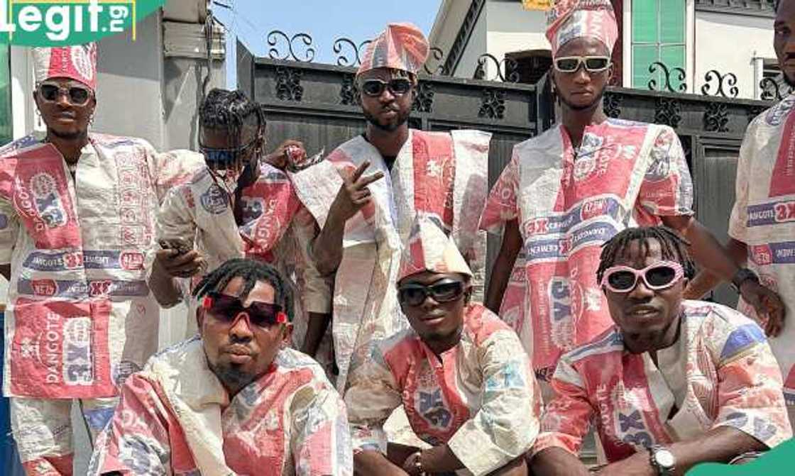 An artist and his crew on Dangote cement attires An artist and his crew on Dangote cement attires