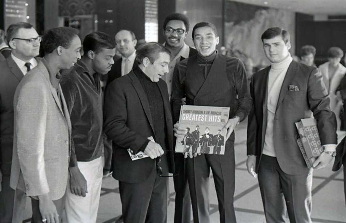 American singer, songwriter and record producer Smokey Robinson with Ronnie White, Bobby Rogers and Pete Moore, collectively known as The Miracles, at an event for Prom Magazine American singer, songwriter and record producer Smokey Robinson with Ronnie White, Bobby Rogers and Pete Moore, collectively known as The Miracles, at an event for Prom Magazine