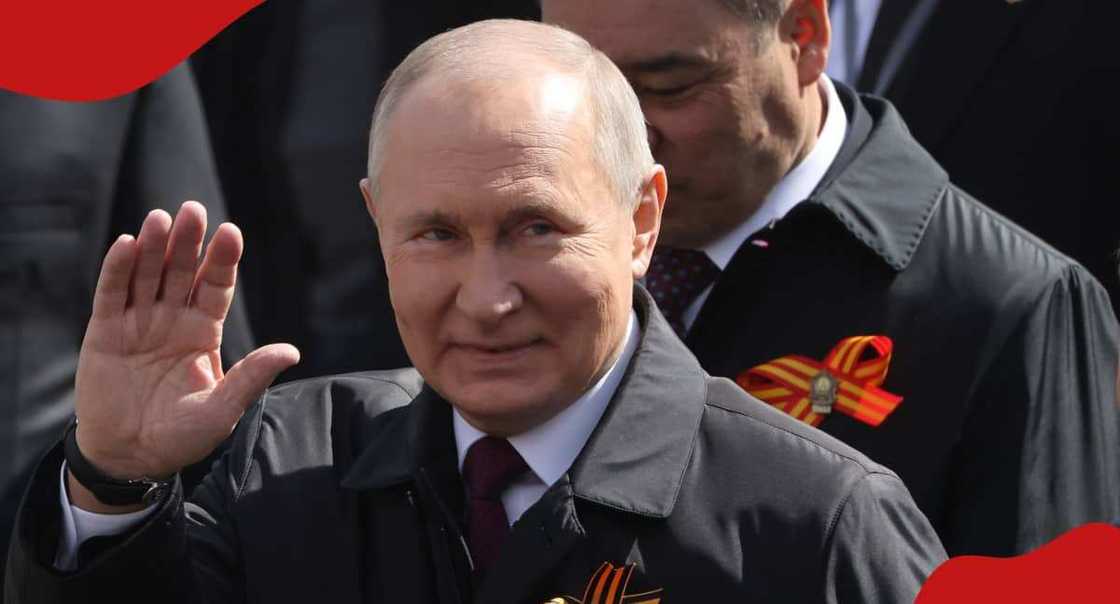 Russian president Vladimir Vladimirovich Putin waving at supporters. Russian president Vladimir Vladimirovich Putin waving at supporters.