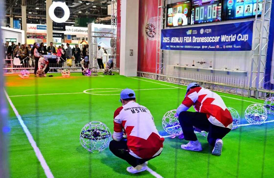 Competitors place their drones in position for drone soccer, a game first invented in 2016 by a South Korean engineer Competitors place their drones in position for drone soccer, a game first invented in 2016 by a South Korean engineer