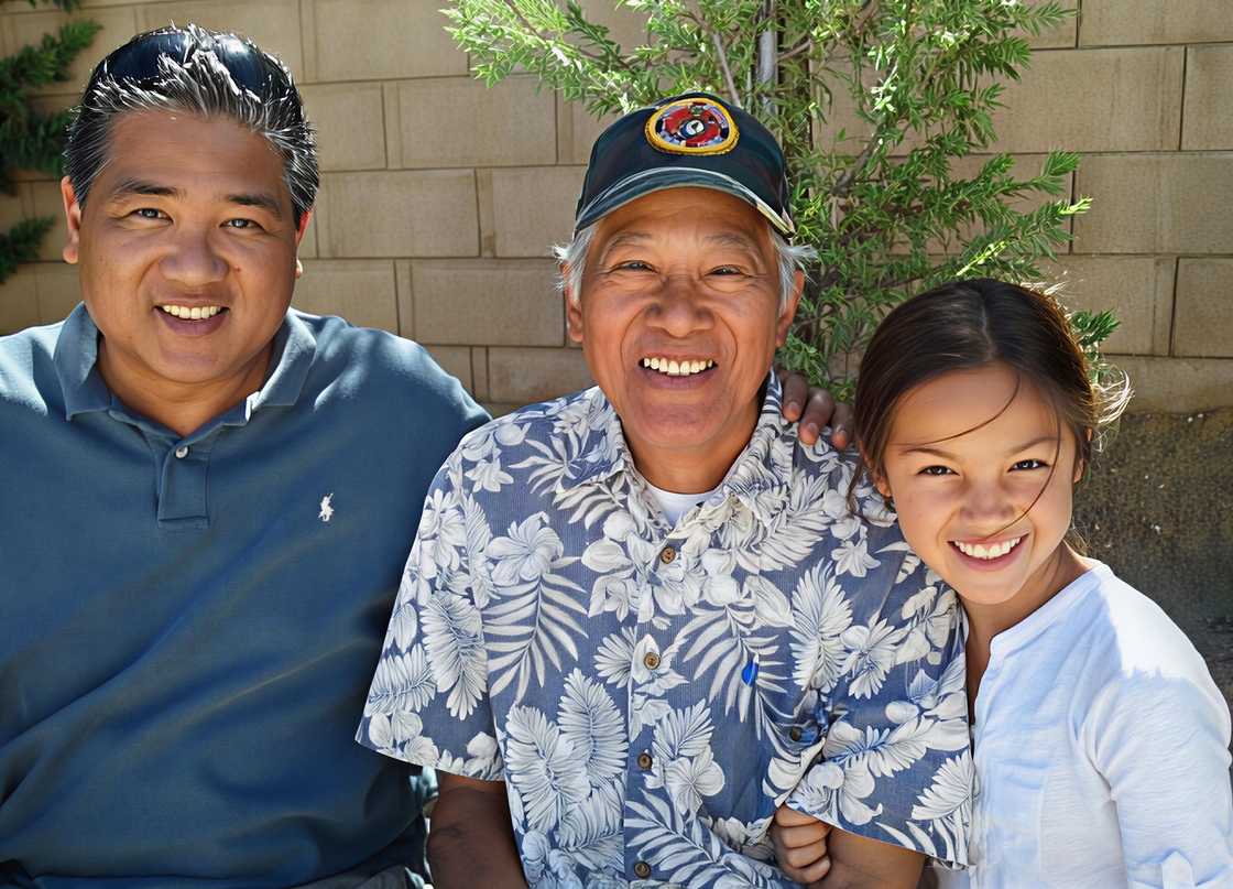 Olivia posing with her father Christopher and grandfather