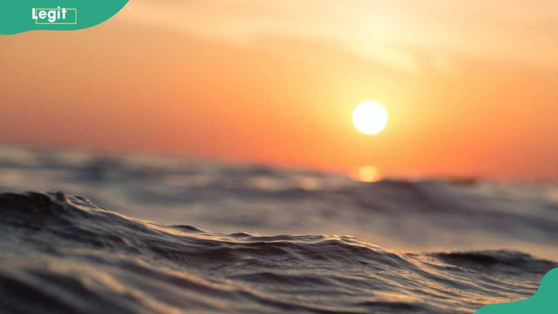 The sun going down over the sea The sun going down over the sea